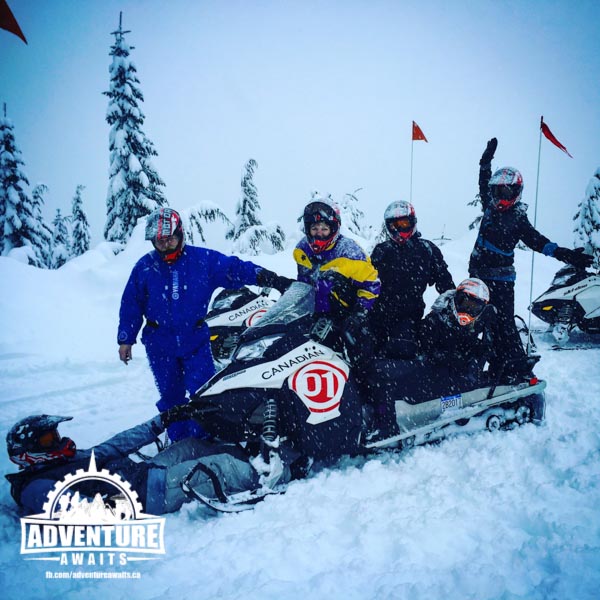 Group posing on their whistler snowmobile tour