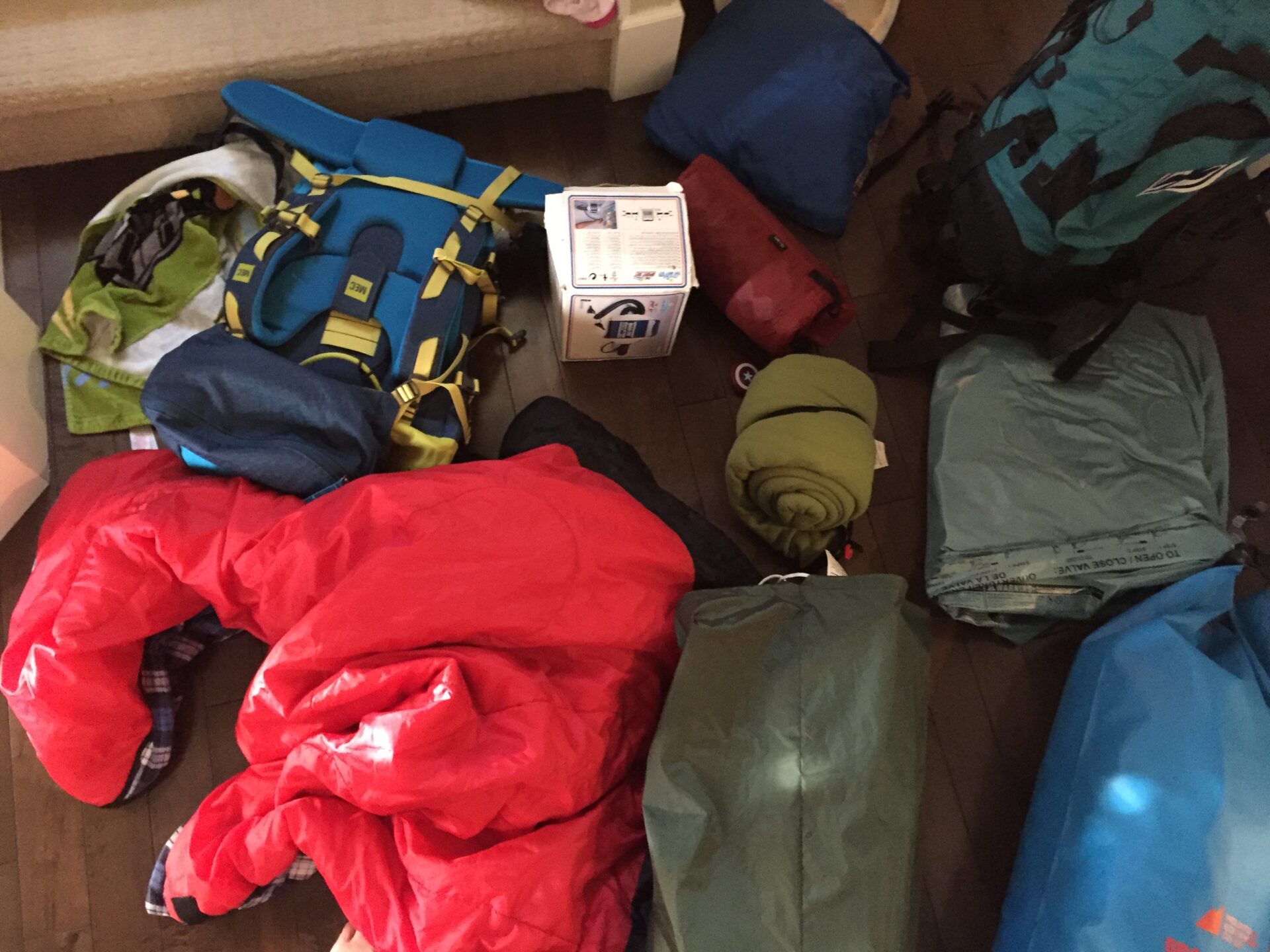 pile of camping gear by the door