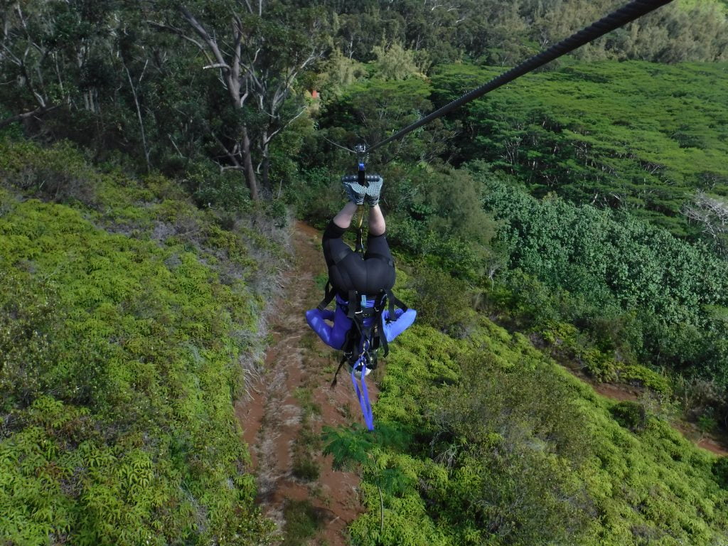 Jami Savage upside down on the Kauai ziplining course