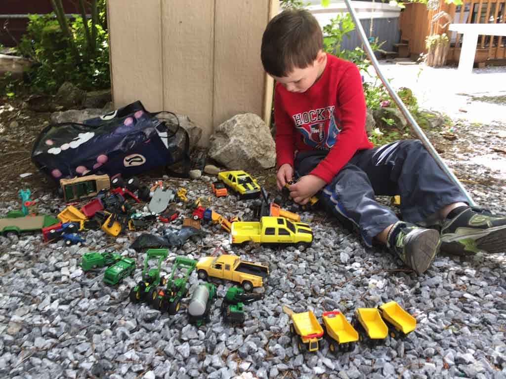 boy-playing-with-trucks