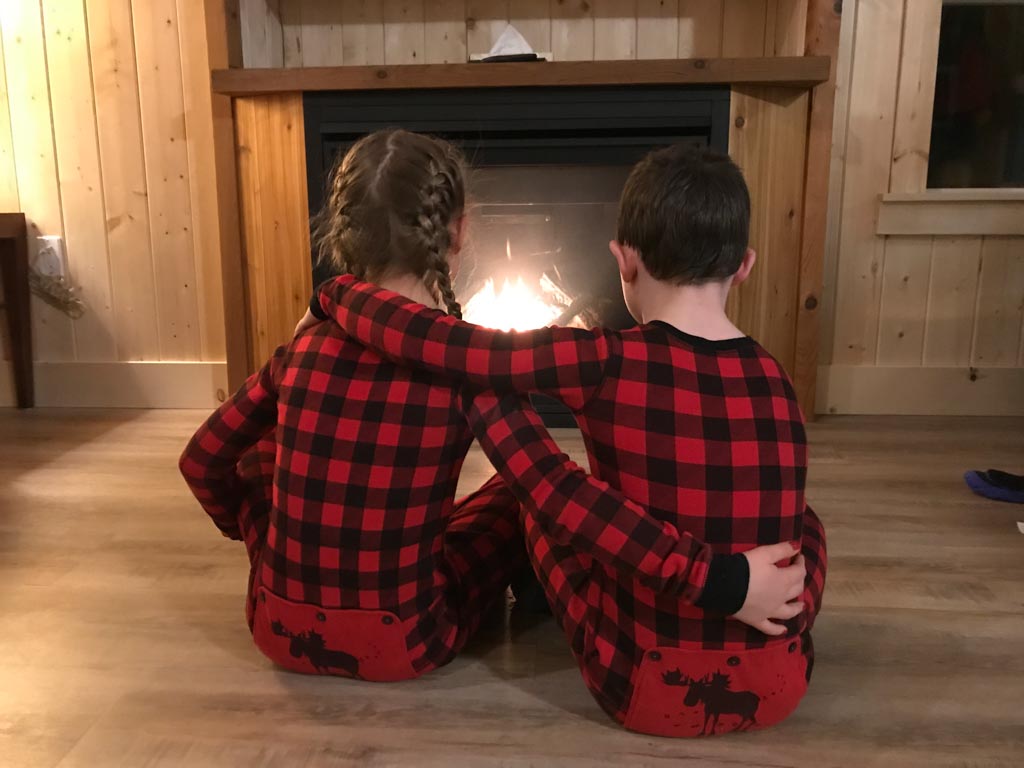 kids-sitting-in-front-of-fireplace