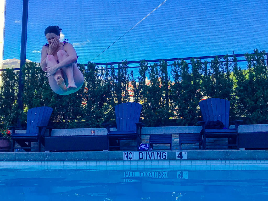 woman-doing-cannonball-in-pool