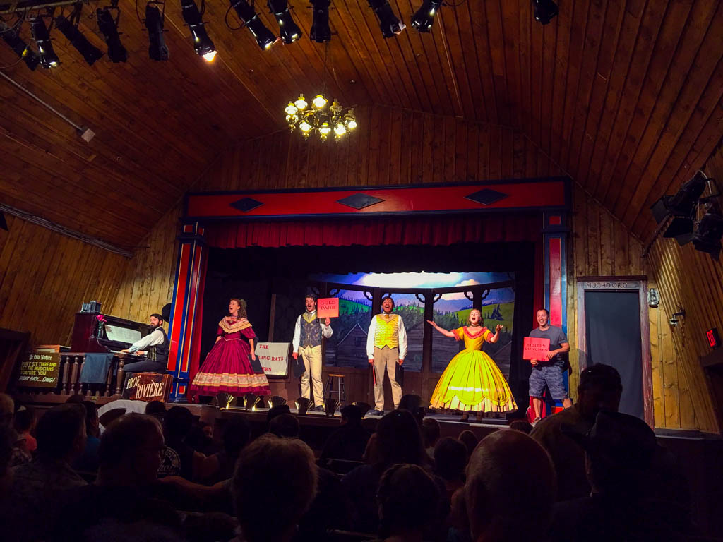 Royal actors on stage in a theatre in Barkerville