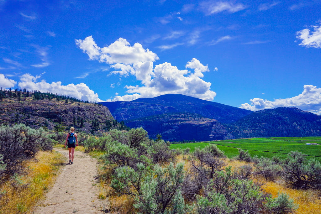 a woman hiking, one of the many things to do in osoyoos