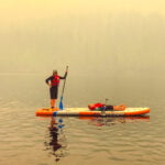 Jami Savage on a paddle board at Heffley Lake paddle board rentals