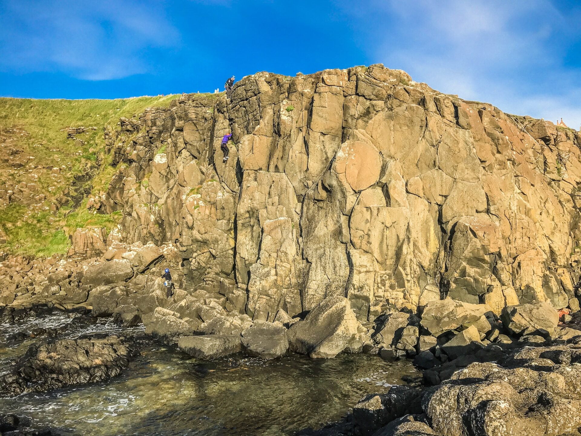 people climbing giants causeway while Rock Climbing Northern Ireland