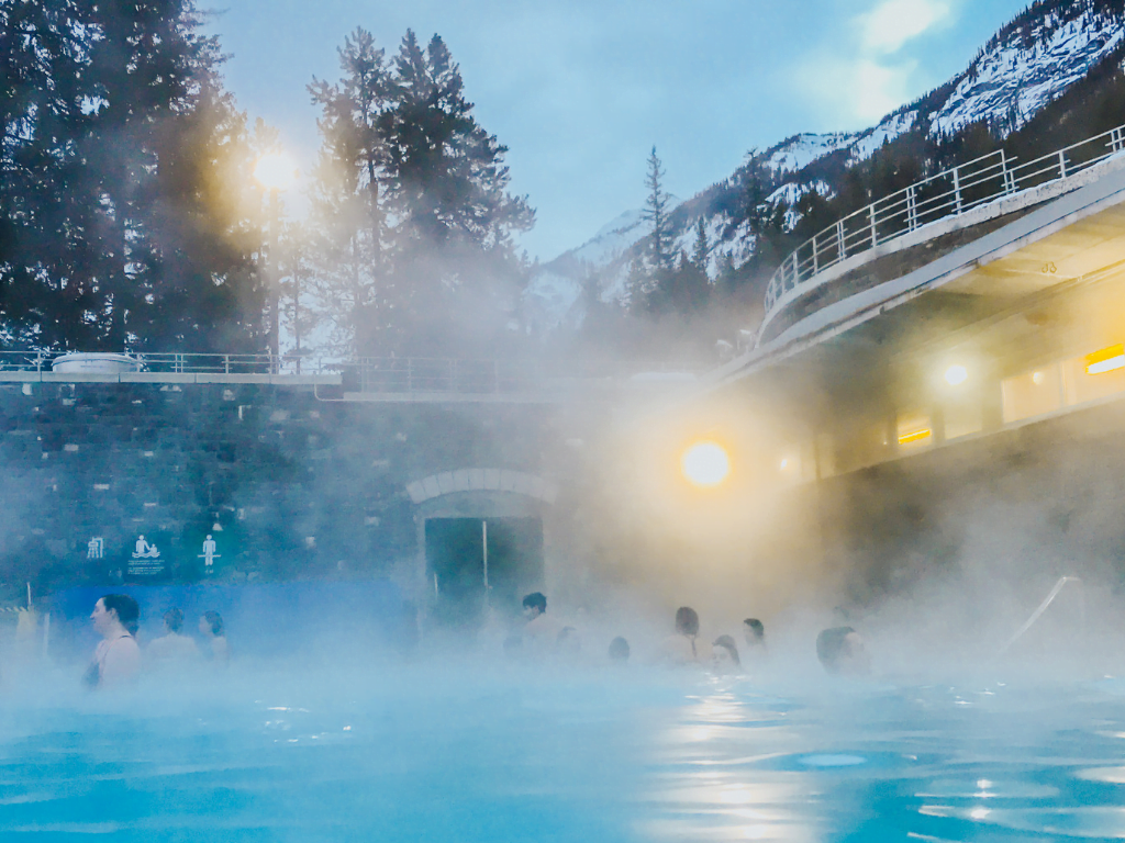 People soaking in banff hot springs