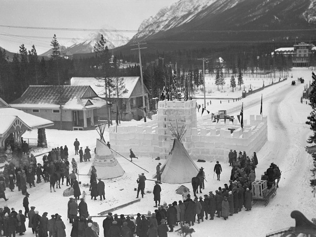 historic black and white photo of the ice palace and teepees in 1930 at the banff snow days festival