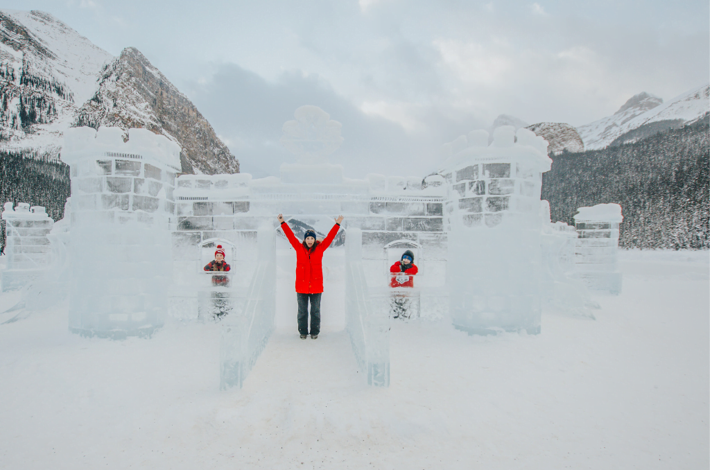Jami Savage inside ice castle at Lake Louise ice festival for the classic Canadian Winter