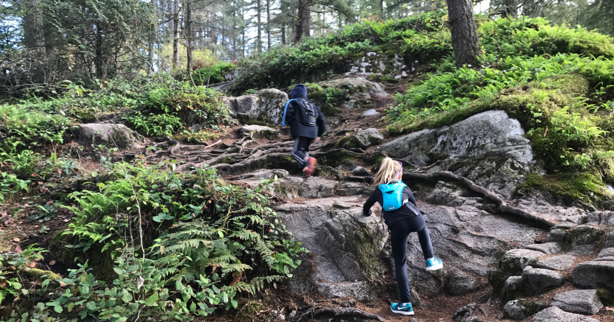 kids hiking up rocks