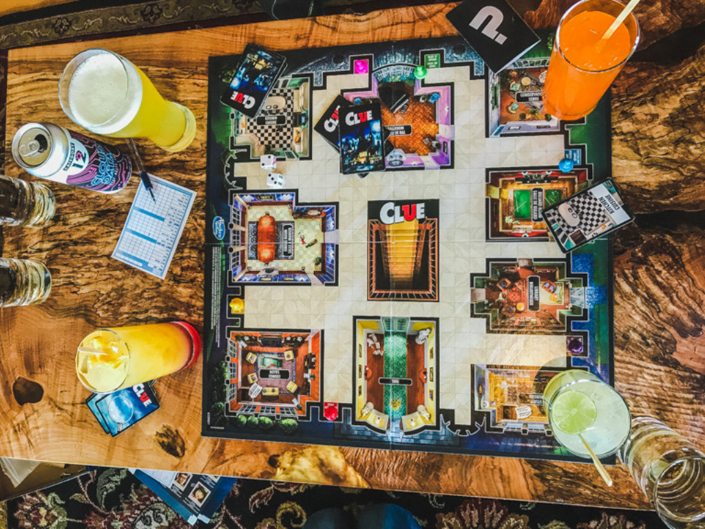 drinks and board game on wooden table in Long Beach Lodge Tofino family resort