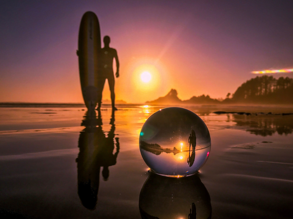 reflection of surfer in lensball