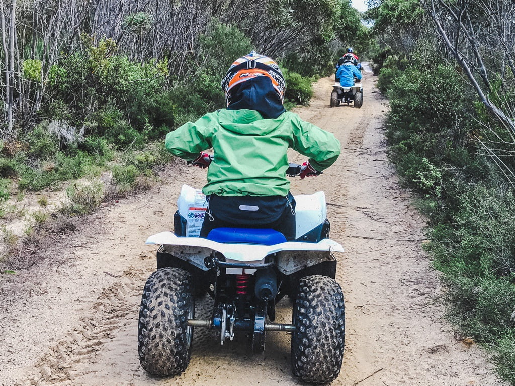 boy riding down dirt path on a quad with Kangaroo Island Outdoor Action 
