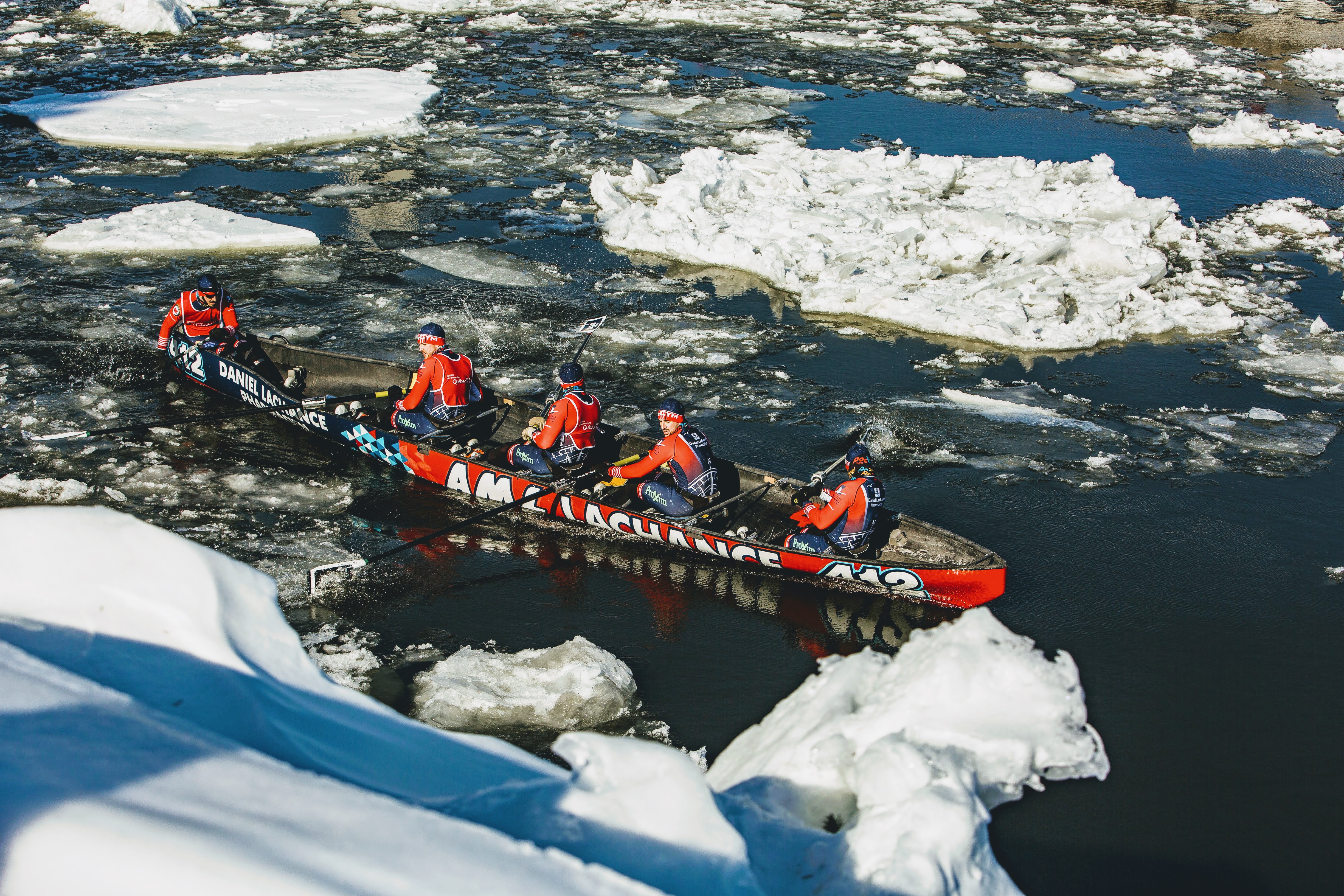teams competing during the ice canoe races at Carnaval De Quebec