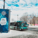 sno bus waiting to load passengers and take them to winterlude