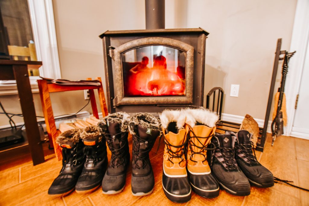 Warming snow boots up by the fire at chalets lanaudiere