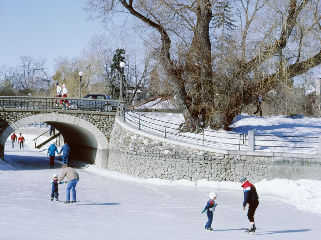 parents skating with their children on the rideau canal