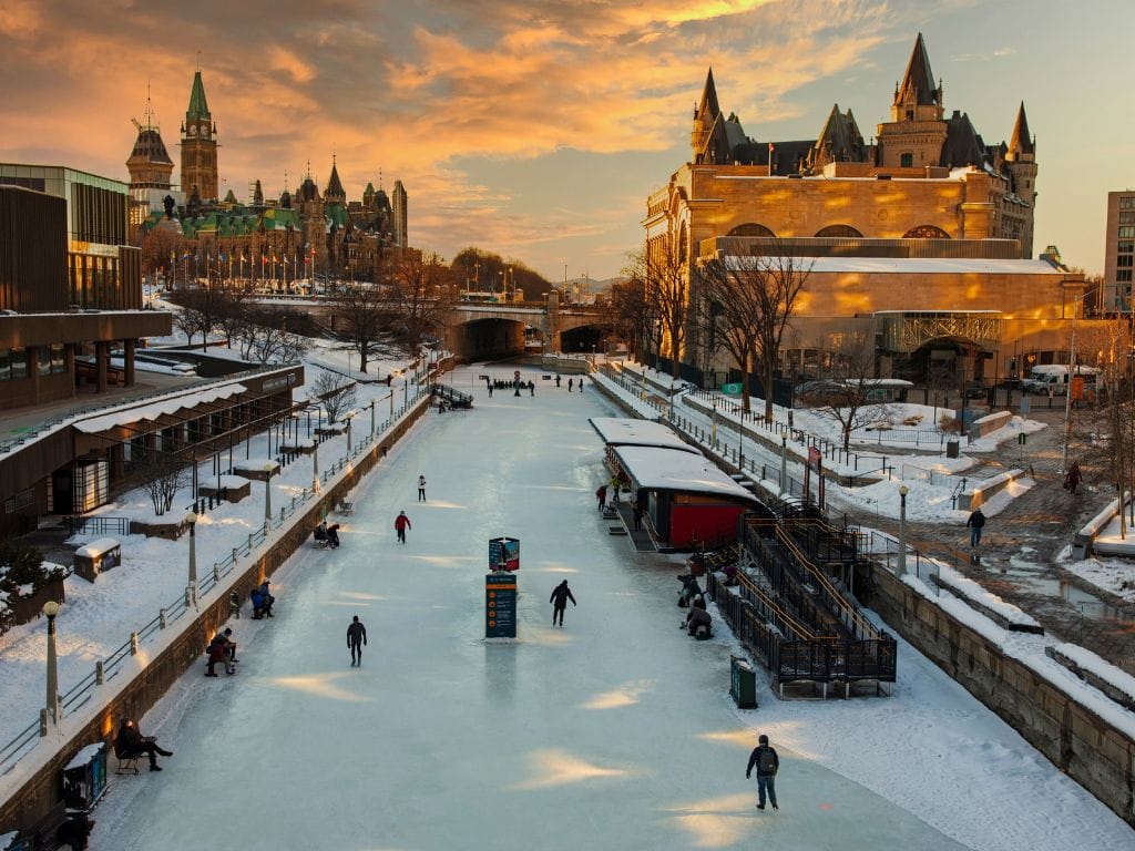 people skating on the rideau canal at dusk