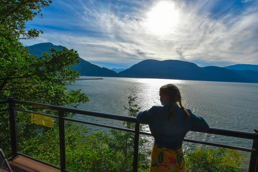 Girl looking out from the balcony at The Lodge At Harrison Lake