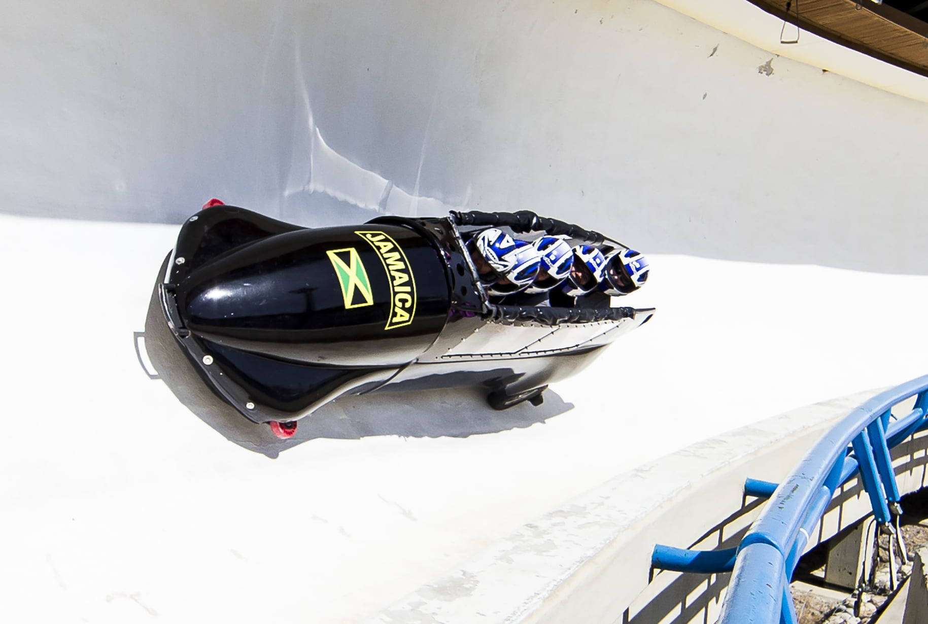 people in a bobsleigh going down the track at WinSport Calgary
