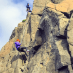 woman repelling during Rock Climbing Northern Ireland