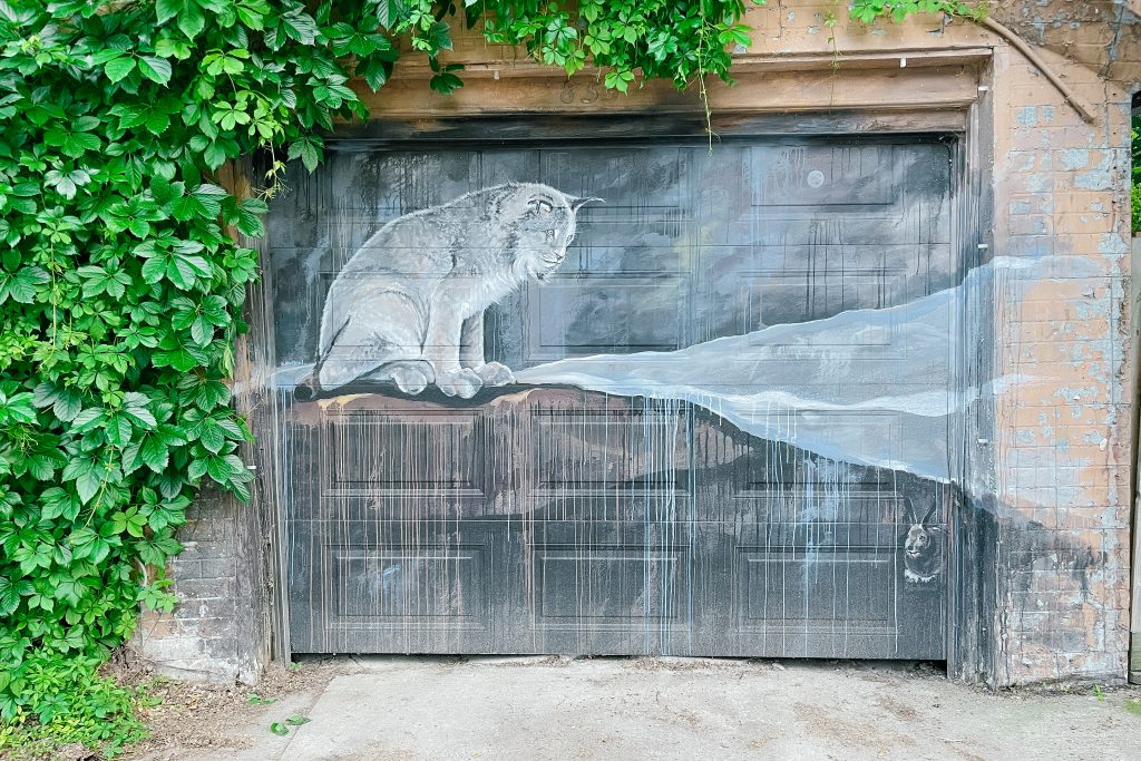 lynx mural on garage door in winnipeg