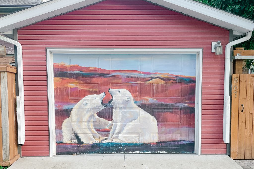 a mural of two polar bears biting each other