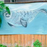 seal mural painting on a fence