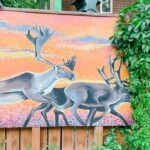 elk mural painted on a fence at the back alley arctic in winnipeg