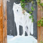 arctic fox mural painted on a fence