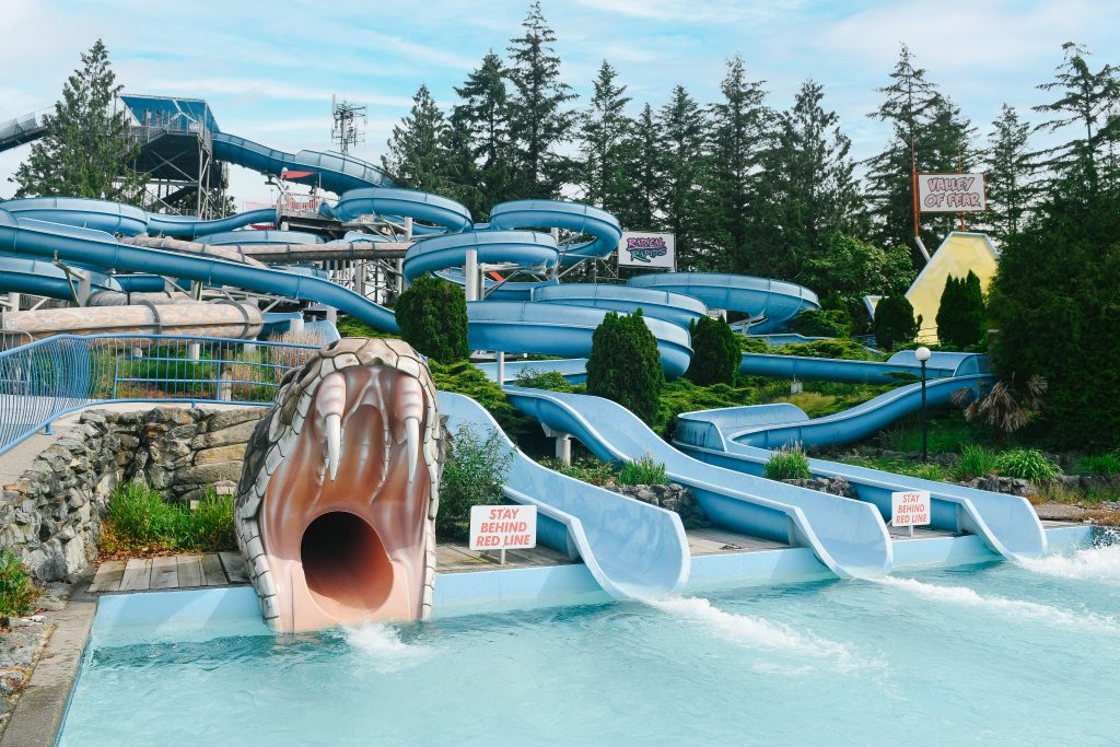 4 waterslides, one is the open mouth of a large snake