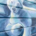 close up of a mural of a polar bear swimming