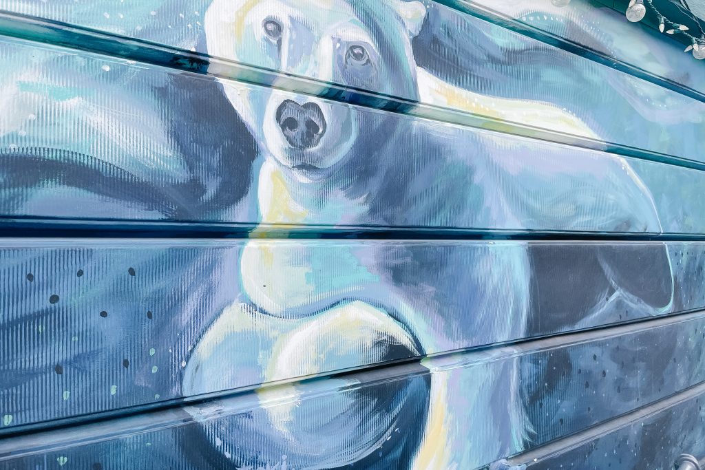 close up of a mural of a polar bear swimming