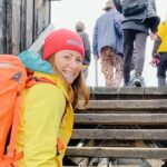 woman climbing onboard tundra buggy adventure