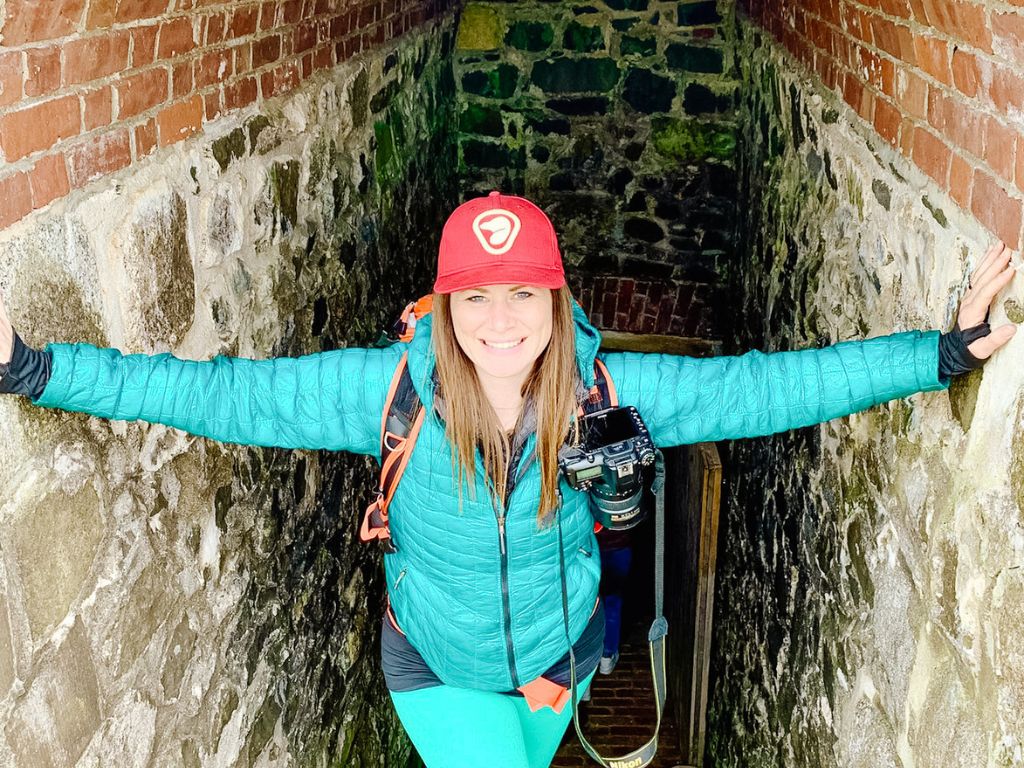 woman coming up the stairs of a historic site in nova scotia