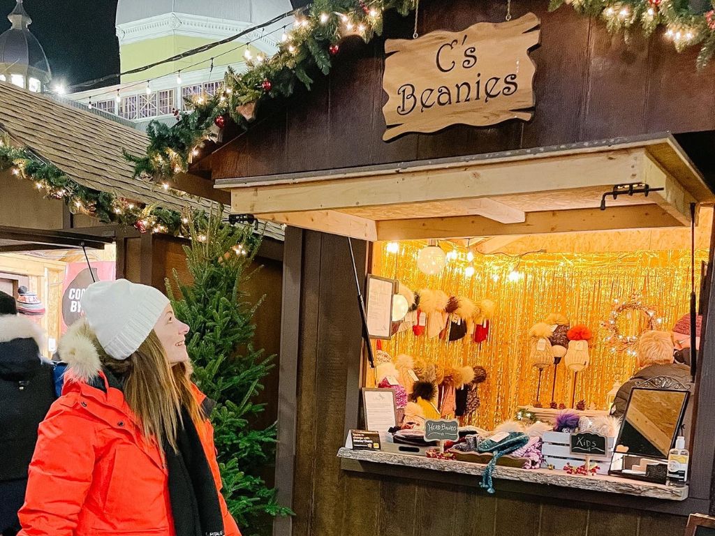 woman checking out a vendor stall at the ottawa christmas market