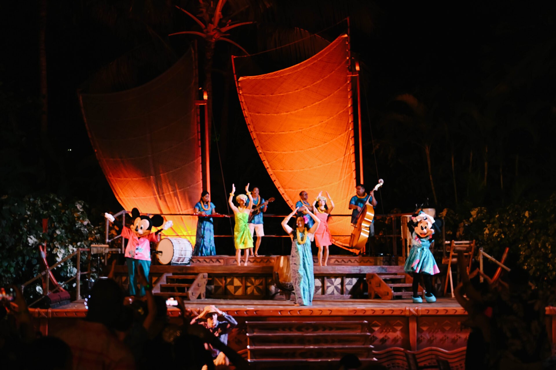 mickey and minnie mouse on stage at the luau at aulani a disney resort and spa