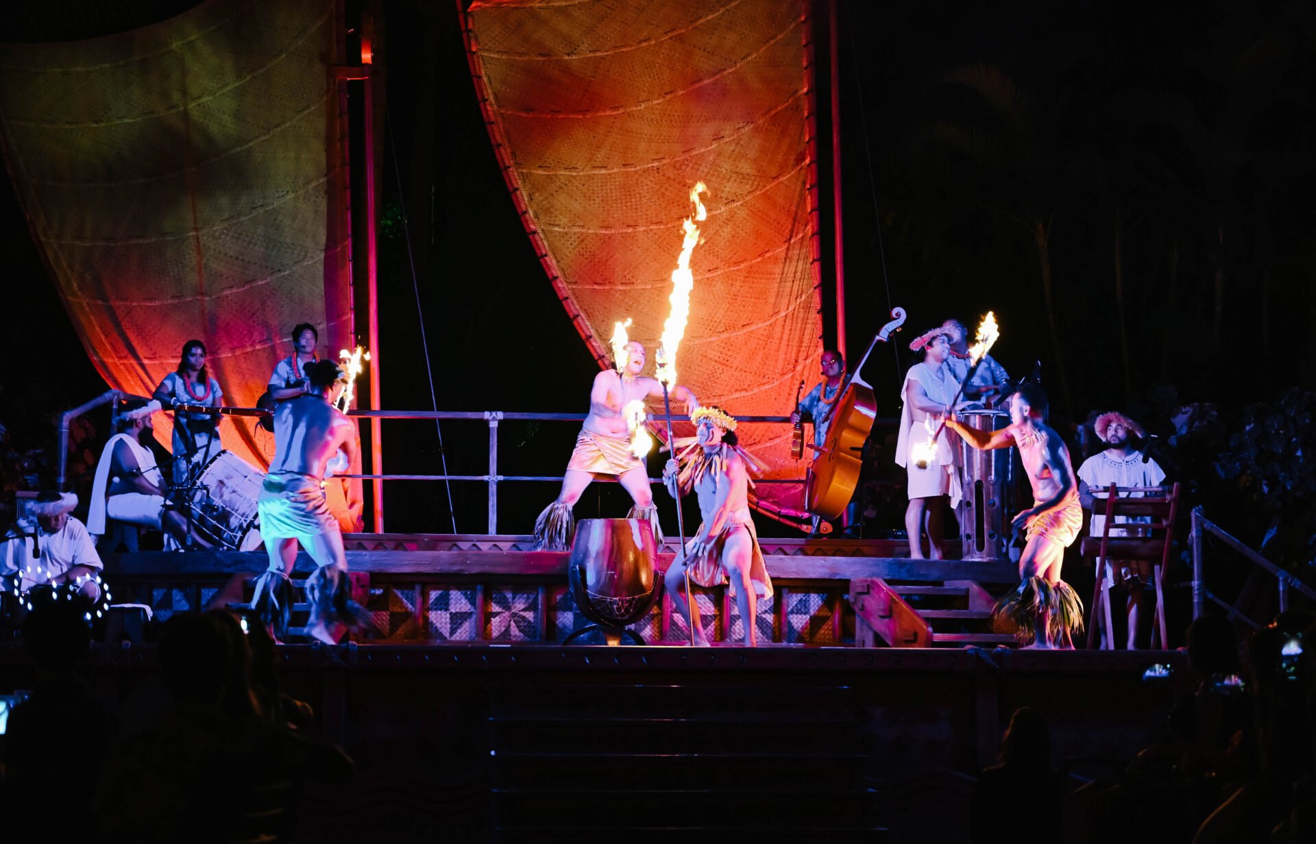 aulani a disney resort and spa luau dancers performing on stage with fire