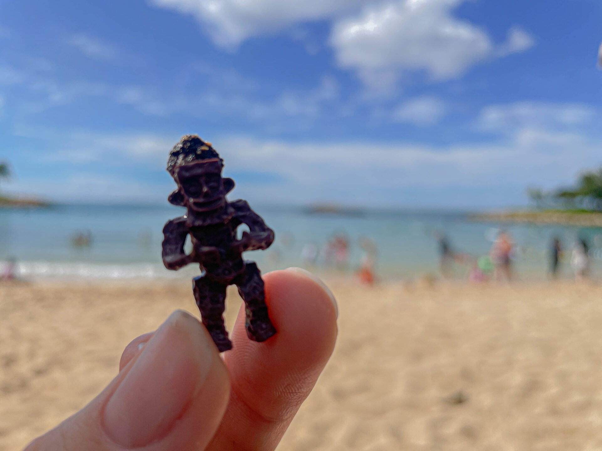 small wooden Menehune found on the beach in front of aulani a disney resort and spa
