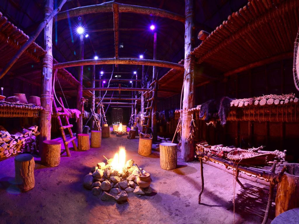 inside view of a longhouse at the wendake adventure in quebec
