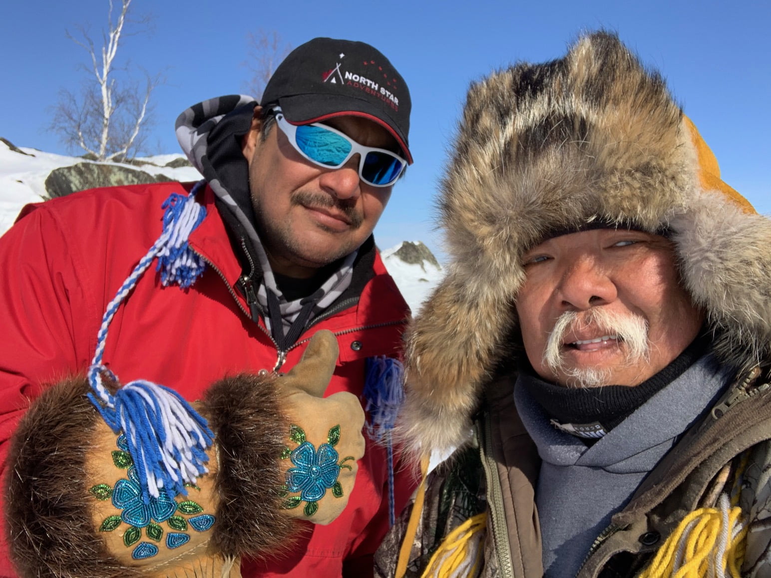 two indigenous guides outside working for north star adventures