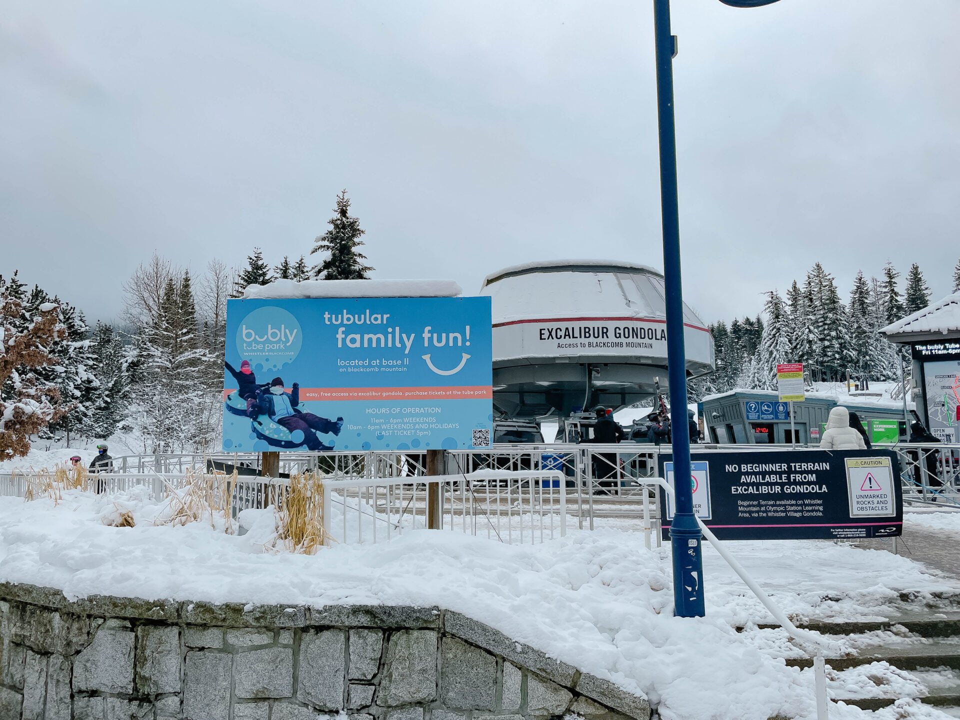 sign for the whistler tube park in front of the gondola