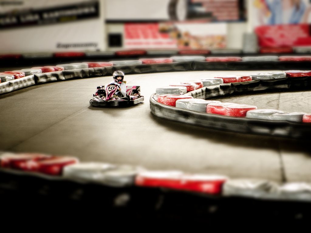 kid driving a go kart at an indoor track, one of the spring break ideas vancouver