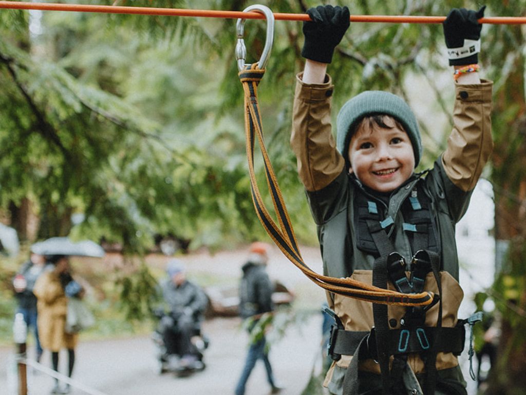boy walking on kids rope course