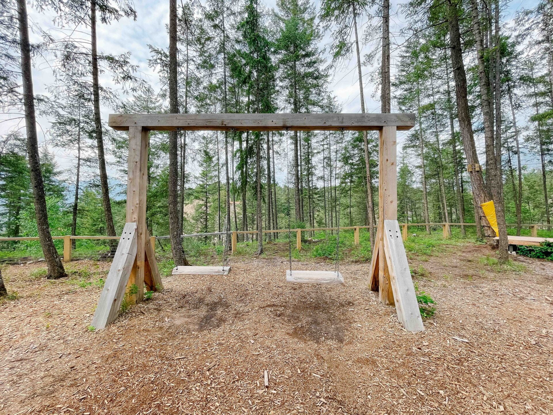wooden swings at the playground area at the golden suspension bridge