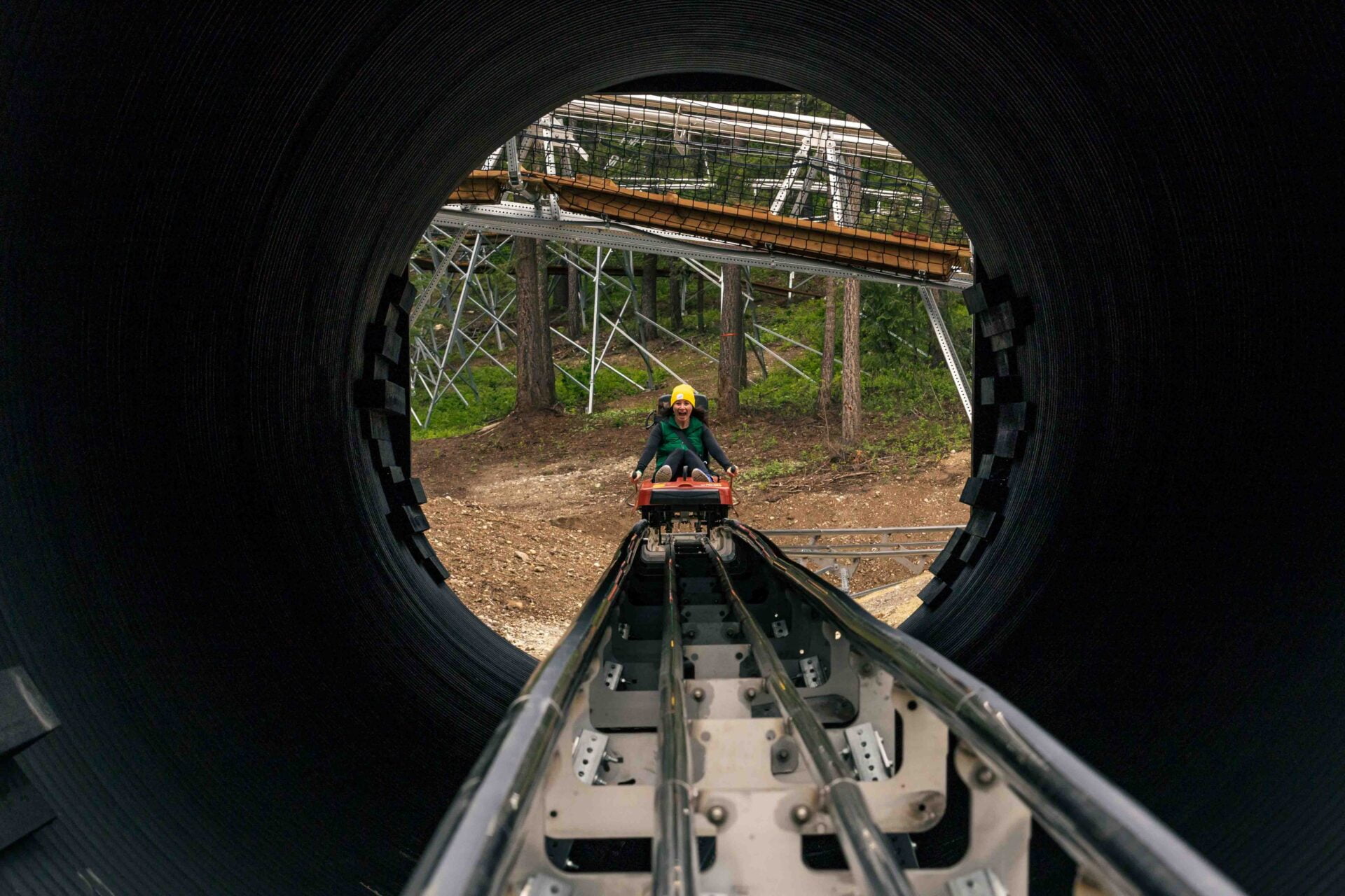 woman coming through a tunnel on the railrider coaster