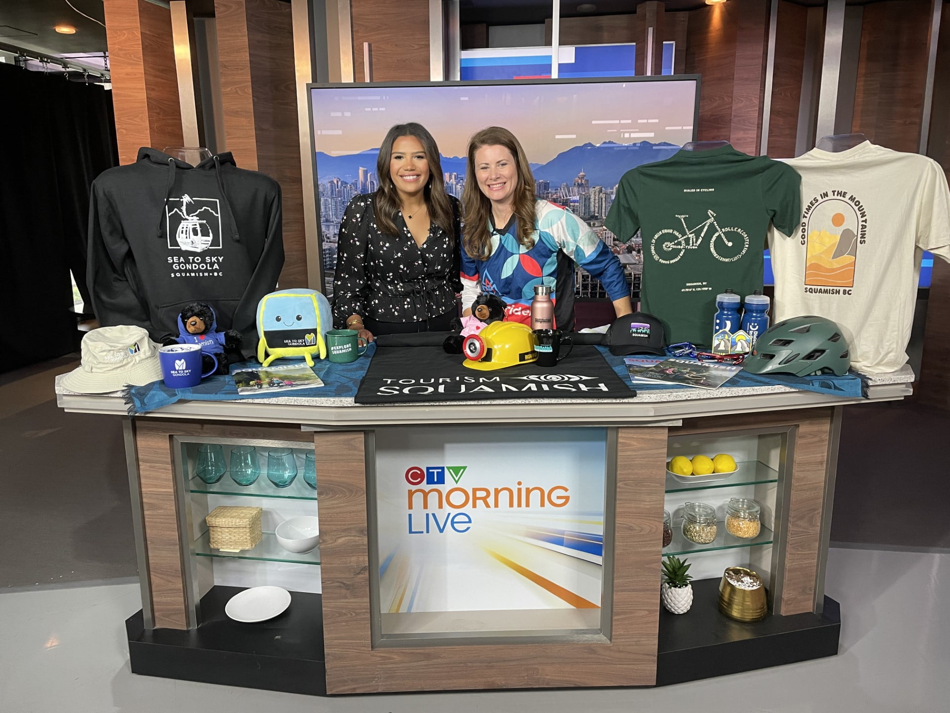 mona and jami standing on the set of CTV morning live, they are behind a table showcasing items from squamish