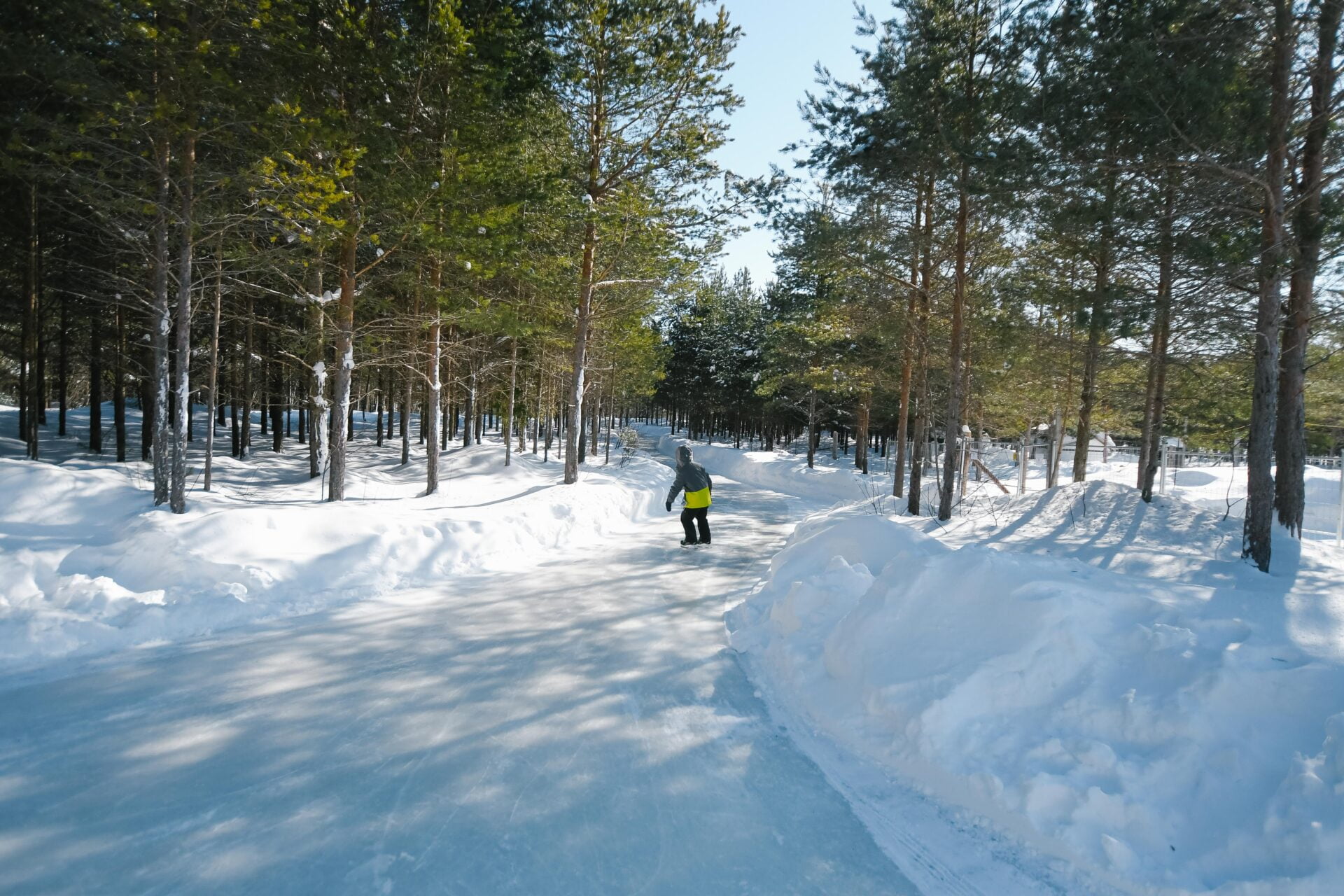 a child is skating through the forest at the lac des loups skating experience