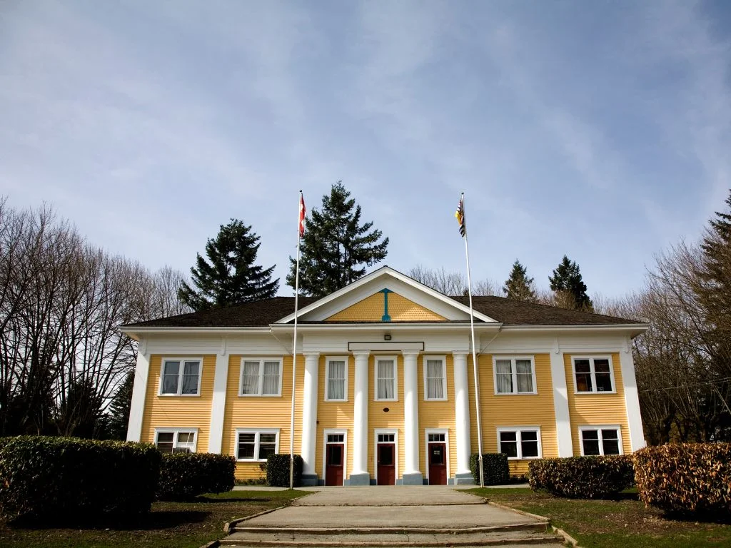 outside view of the community hall building in fort langley