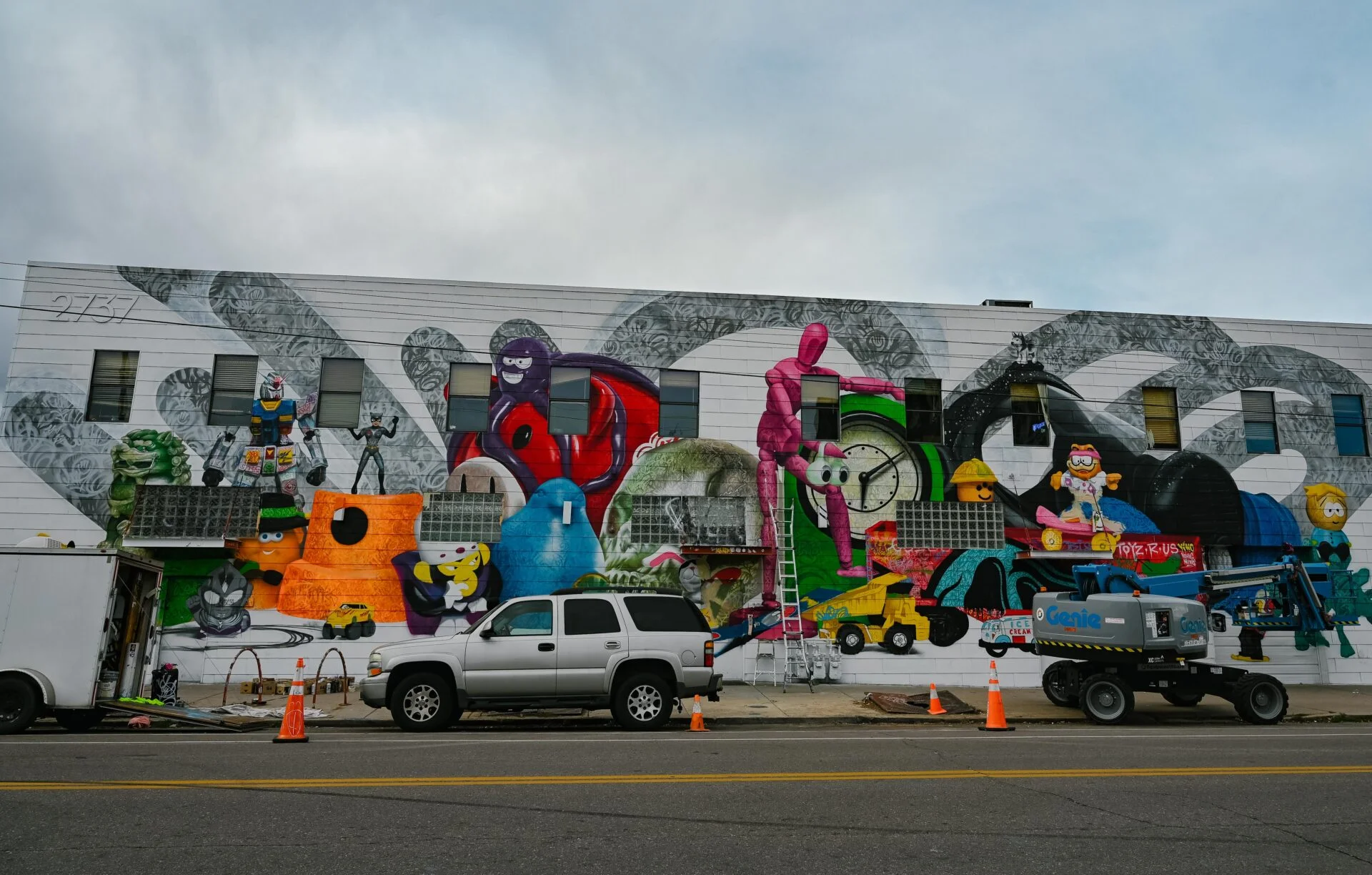 block long mural of a variety of childhood toys